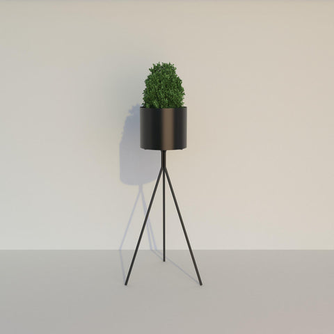 Terra Tall Cylindrical Metal Planter — styled interior view | حوض زرع تيرا المعدني الأسطواني المرتفع — ضمن تنسيق داخلي