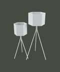 Contemporary hexagonal planter pot with stylish tripod base for indoor or outdoor plants وعاء زرع سداسي عصري بقاعدة ثلاثية أنيقة