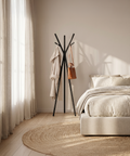 modern multipurpose cloths rack standing in a stylish bedroom with a robe and bag hanging.