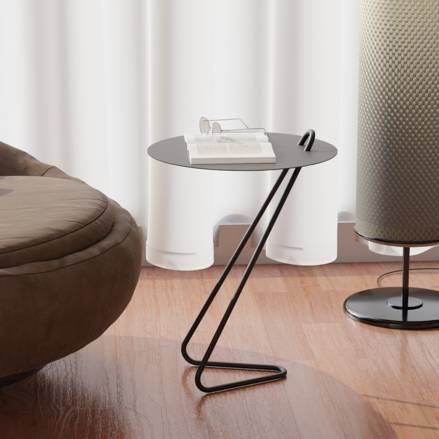 Angolo modern side table with a sleek design next to a cozy chair and a lamp, perfect for small spaces.