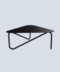 Triangular modern metal coffee table with sculptural legs in living room طاولة قهوة معدنية عصرية بشكل مثلث وأرجل نحتية في غرفة المعيشة