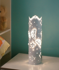Butterfly shaped stainless steel table lamp with warm ambient lighting مصباح طاولة فولاذي على شكل فراشة مع إضاءة محيطية دافئة